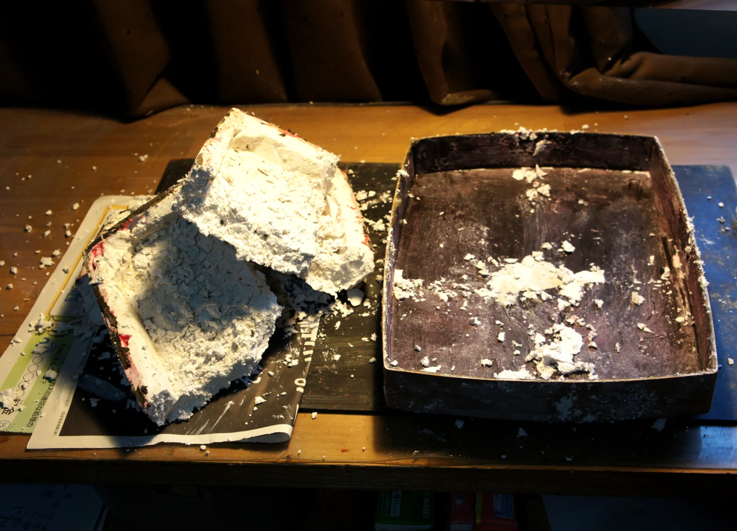 Breaking and removing the plaster core to reveal the hollow dry lacquer box.