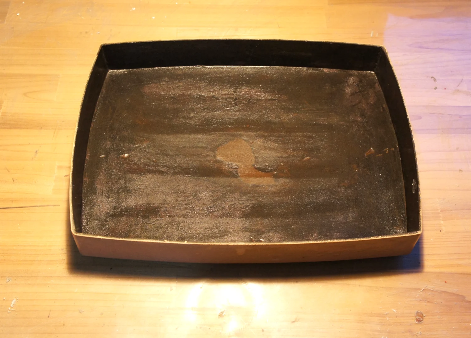 The dry lacquer piece after removing the plaster mold and wet-sanding the surface with a whetstone.