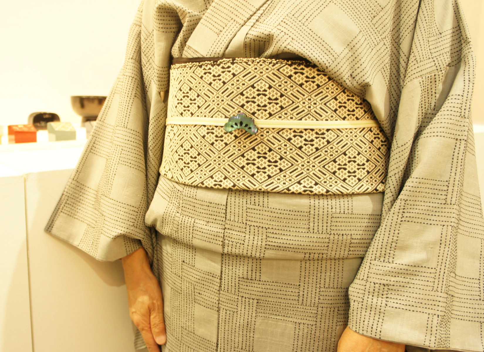 Art Fair Tokyo 2026, the renowned art collector Ms. Hiroko Ishinabe wearing a stunning kimono and obi ensemble coordinated specifically with the pine obi-dome. 