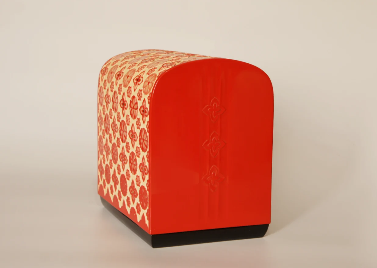 The side of the Choshitsu (carved lacquer) Stacked Boxes with Flower Patterns