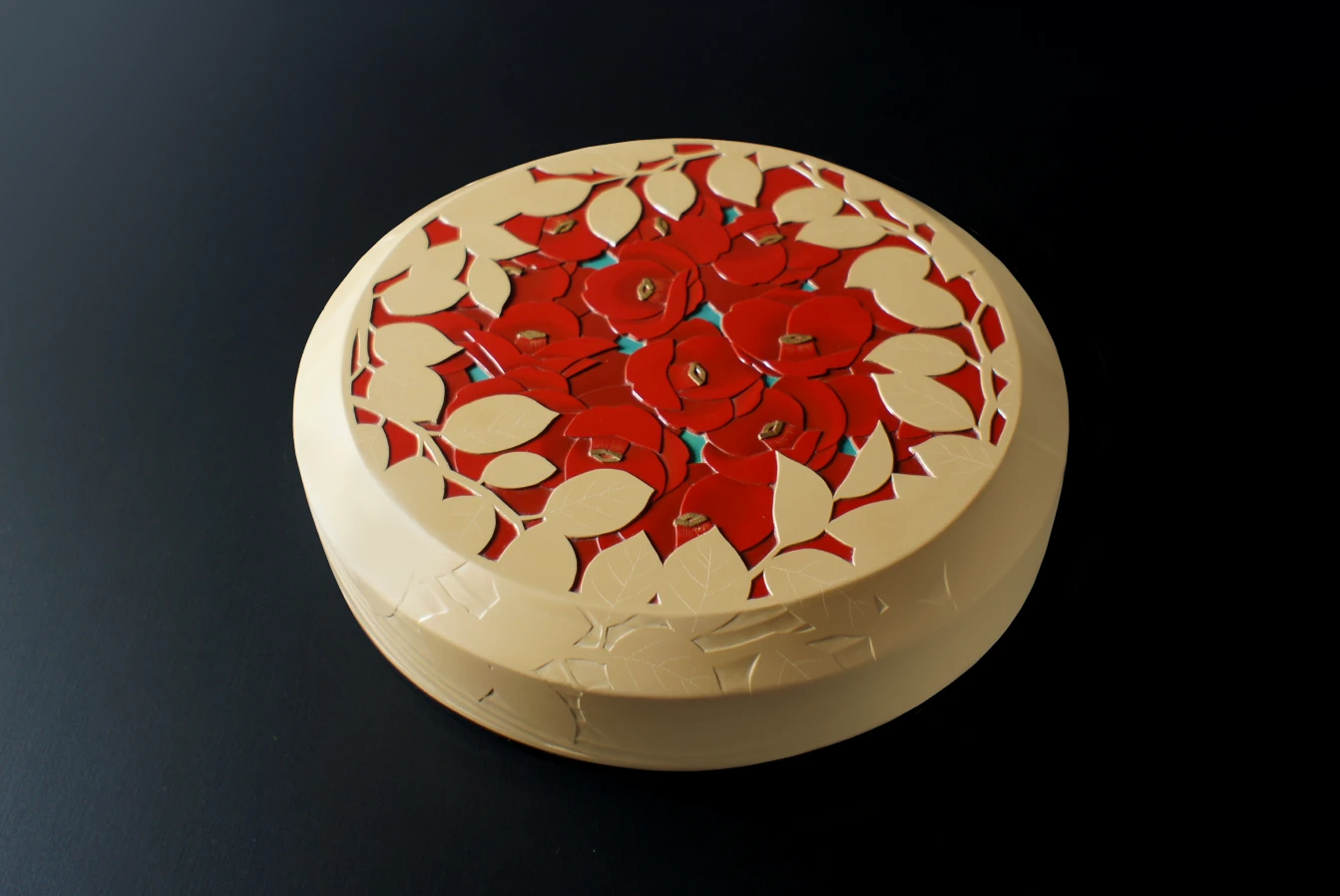 The Urushi (Japanese lacquer) box titled Fallen Camellia. The body is kanshitsu. By Kaori Sugano.