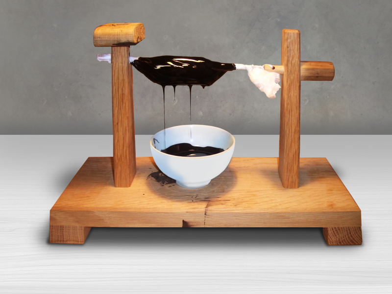 Black urushi (lacquer) is filtered