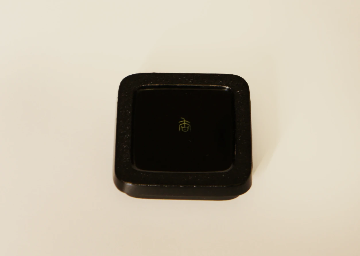 The bottom backside of the Choshitsu (carved lacquer) Incense Container - Four-leaf Clovers